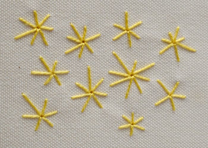 Ricamo Occhiello Punto Stella con filo di cotone giallo perla